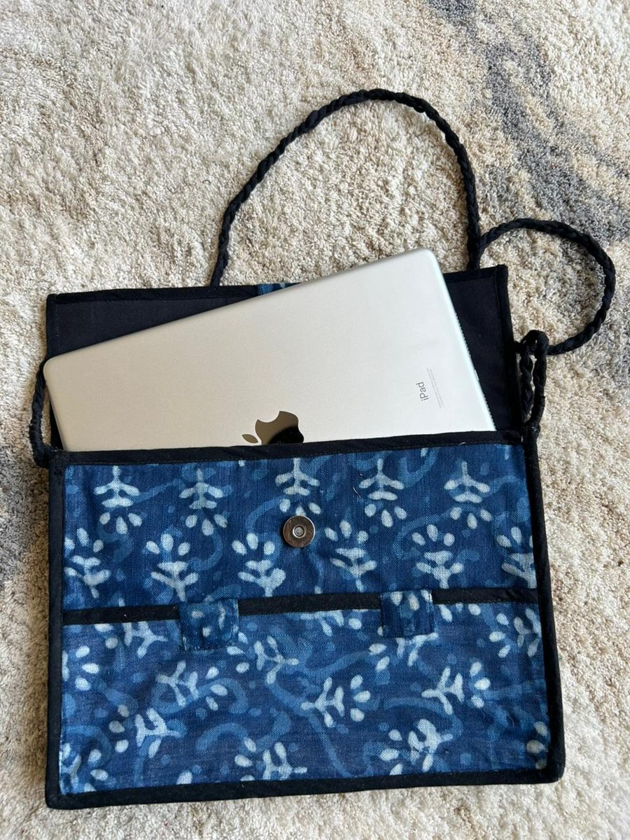 Indigo hand-block print laptop sleeve with a laptop half inside